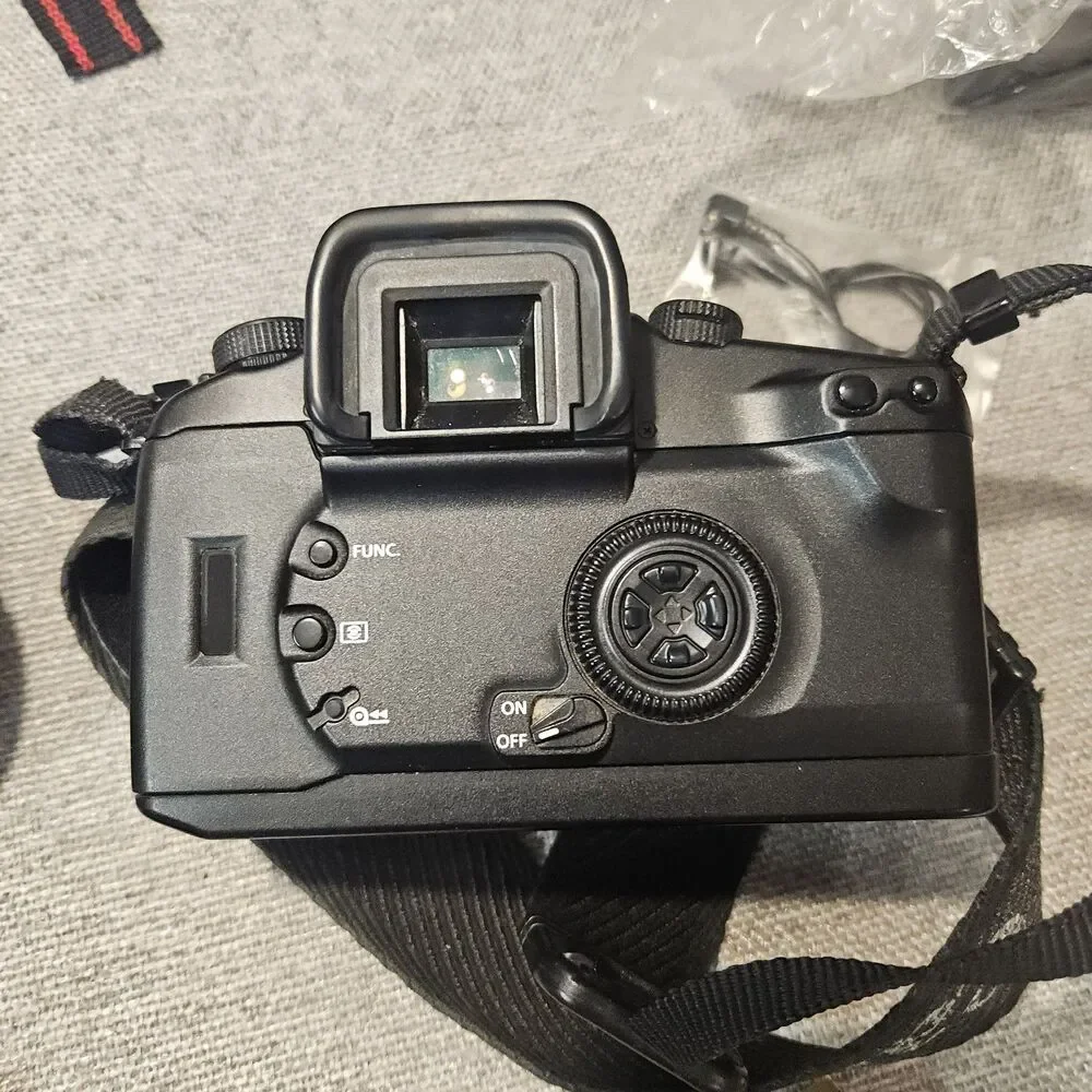 Canon EOS Elan 7E 35mm Film Camera Bundle w/  2 Lenses  Bag Flash Filters More